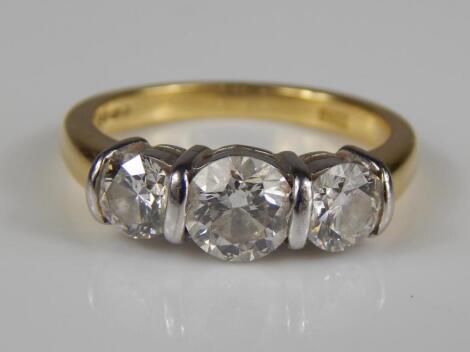 An 18ct gold three stone diamond ring