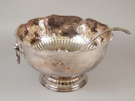 A modern silver plated punch bowl