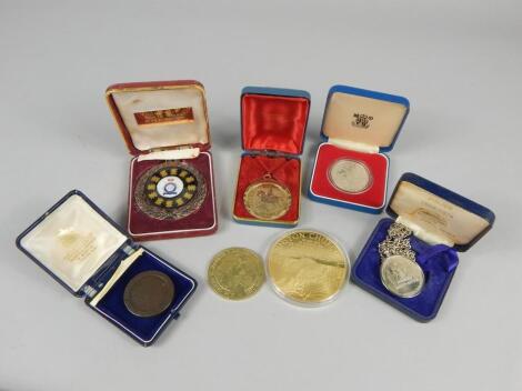 A collection of commemorative medallions etc