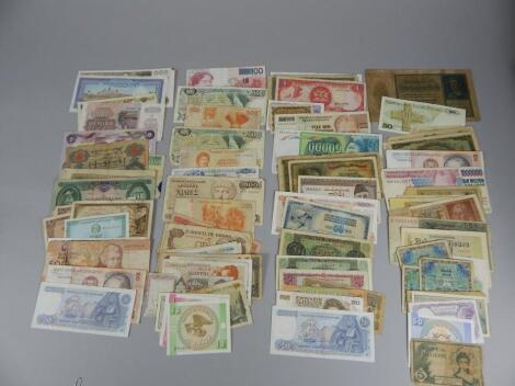 A box of approximately one hundred mixed foreign bank notes