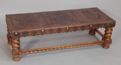 A Peruvian hardwood and leather coffee table