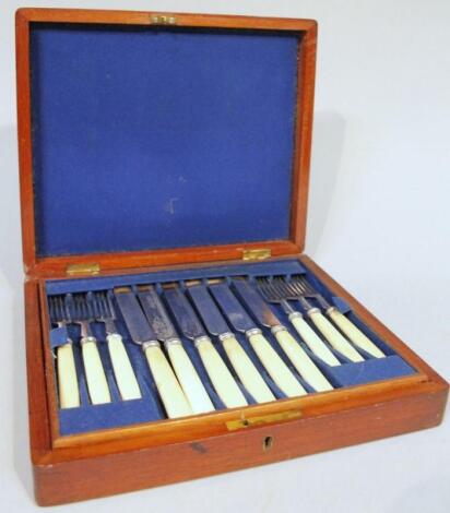 An Edwardian mahogany cased canteen of cutlery