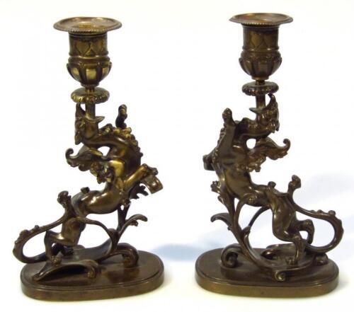 A pair of 20thC bronzed style candlesticks