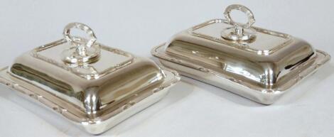 A pair of early 20thC silver plated entreé dishes