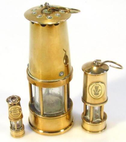 Two 20thC graduated miniature miner's lamps