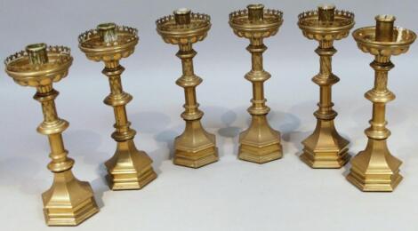 A near matching set of six early 20thC brass alter candlesticks