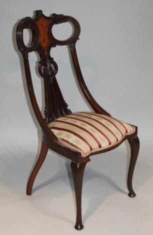 An Edwardian mahogany walnut and boxwood strung salon chair