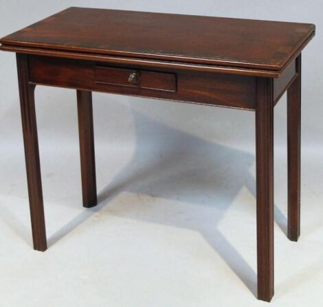 An early 19thC mahogany stained fold over tea table