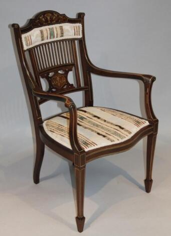 An Edwardian mahogany and bone inlaid elbow chair