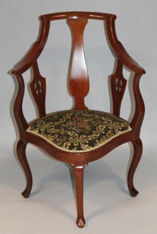 An Edwardian mahogany salon chair