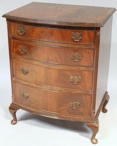 A 20thC walnut finish bow front chest