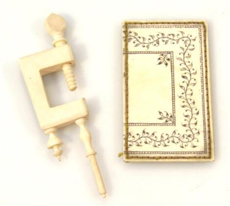 A late 19thC ivory sewing clamp
