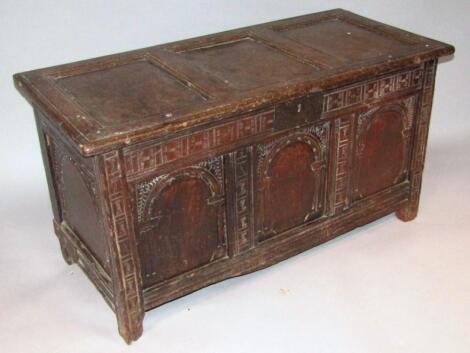 An early 18thC oak three panelled coffer