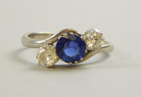 A sapphire and diamond three stone ring