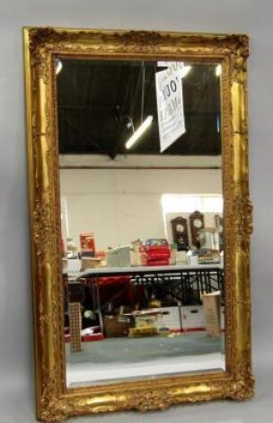 A rococo style gilt rectangular wall mirror