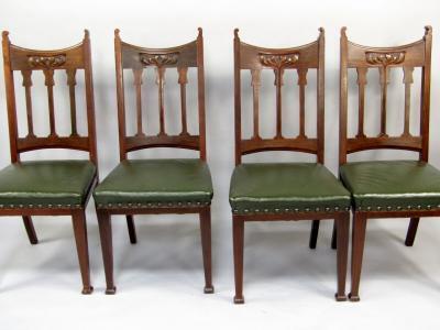 A set of four Edwardian walnut dining chairs