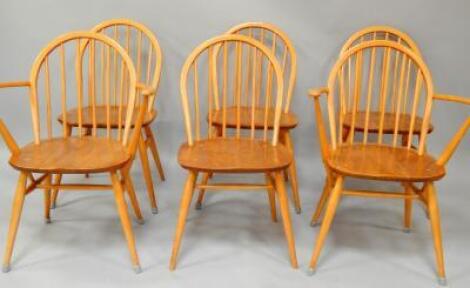A set of six Ercol ash and elm stick back dining chairs