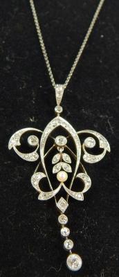 A Victorian belle époque diamond and seed pearl drop pendant