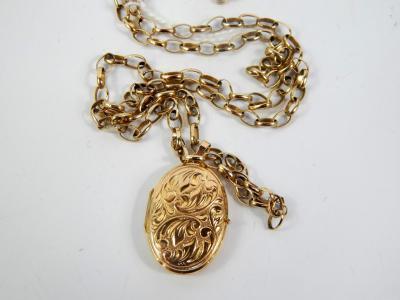 A 9ct gold oval double photo locket