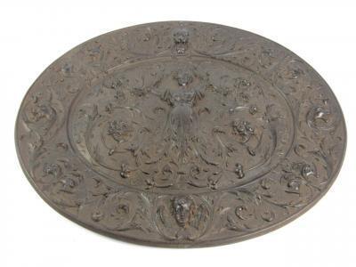 A Victorian cast iron oval wall plaque