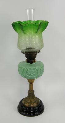 A Victorian brass and green opaline glass oil lamp