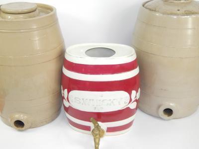 A pair of buff stoneware spirit barrels