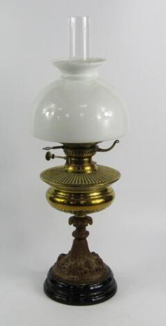 A Veritas cast metal oil lamp