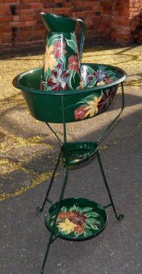 A bargeware type floral painted green wash jug