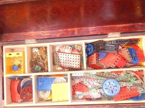 A Meccano selection within wooden trunk