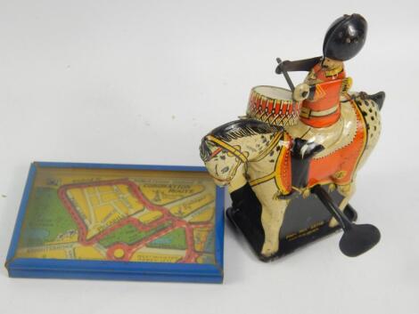 A British clockwork drumming soldier on horseback