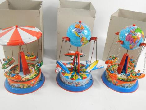 Three reproduction tin plate carousels