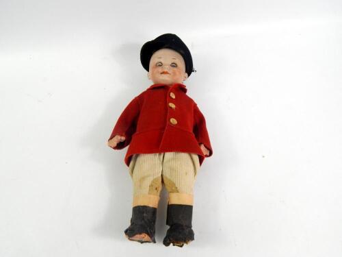 An early 20thC Armand Marseille bisque headed hunting doll