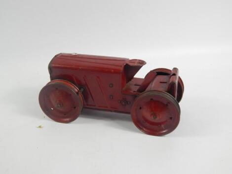 A vintage Tri-ang tin plate clockwork tractor