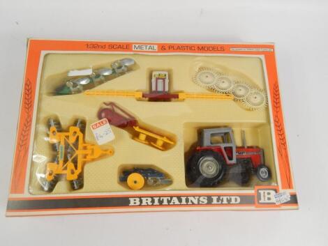 A Britains Limited boxed farm tractor and implements set