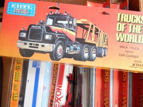 A collection of die-cast trucks and other vehicles