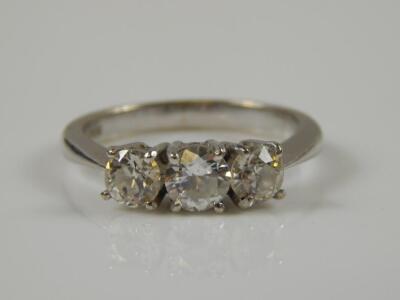 An 18ct white gold three stone diamond ring