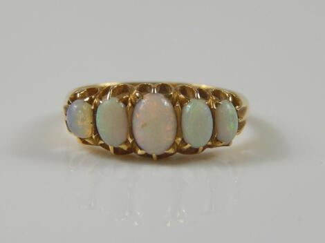 An 18ct gold opal dress ring