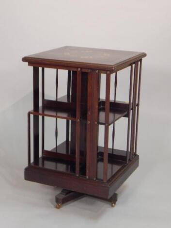 An Edwardian mahogany and marquetry revolving bookcase