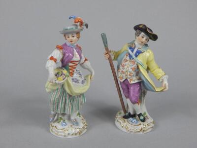 A near pair of Meissen style figures