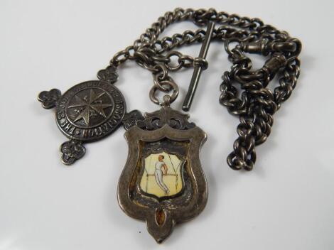 A silver watch chain and two seal fobs