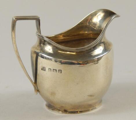 A George V silver milk jug