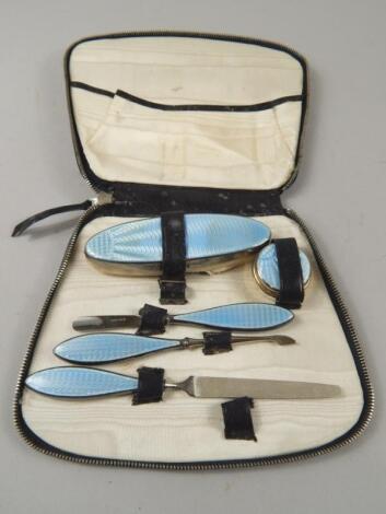 An Art Deco period silver and blue guilloche enamel part manicure set