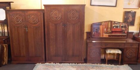 A mid to late 20thC Gothic oak part bedroom suite