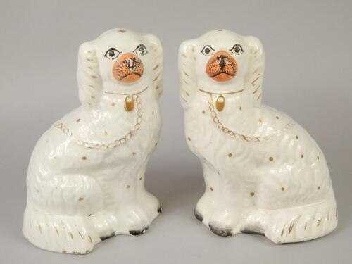 A pair of 19thC Staffordshire spaniels