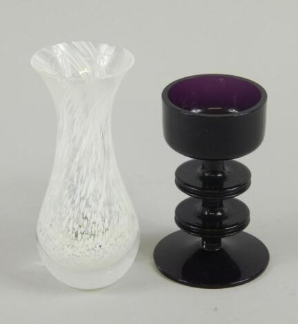 A retro style purple tinted glass candle stand