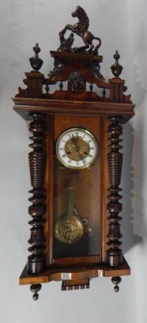 A late 19thC Vienna type walnut wall clock