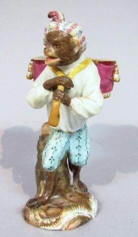 An early 19thC Meissen porcelain monkey band figure