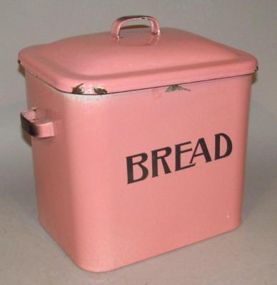 An early 20thC pink enamel bread bin