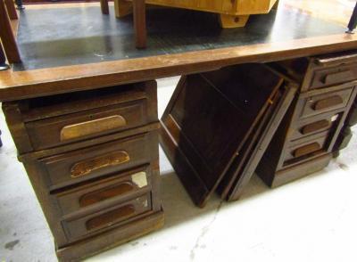 *An early 19thC oak twin pedestal office desk