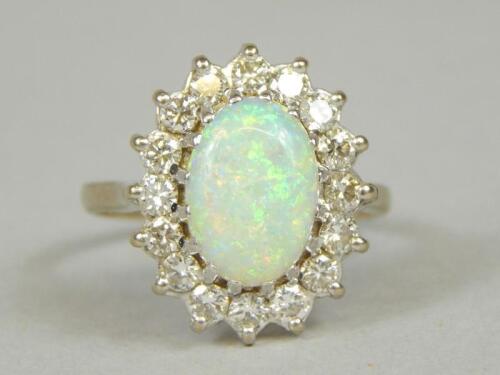 An opal and diamond ring